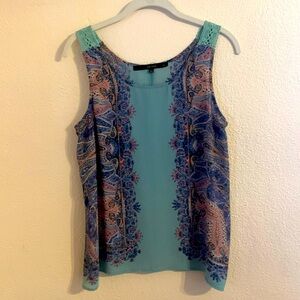 Slightly sheer, flowy tank with crochet-like strap detail